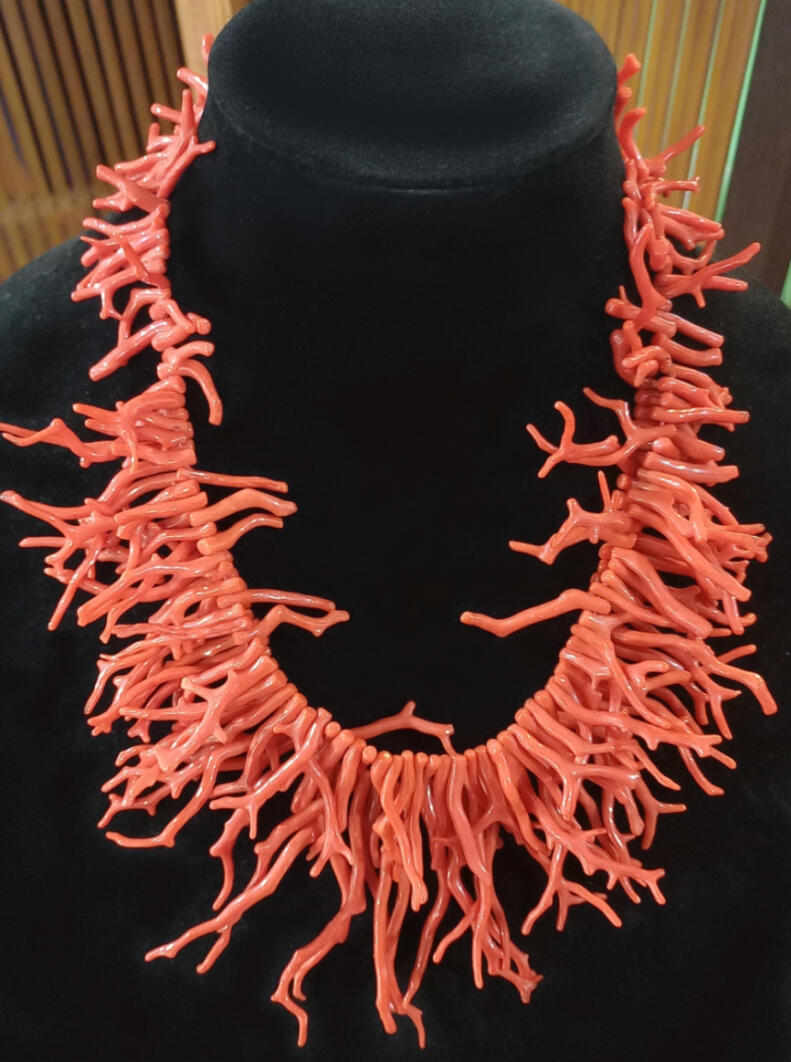 Necklace made from Croatian coral, two strands of longer coral pieces at the front, shorter pieces on one strand at the back for A striking necklace in Croatian coral, two strands of longer coral pieces at the front, shorter pieces on one strand at the back for a good fit.